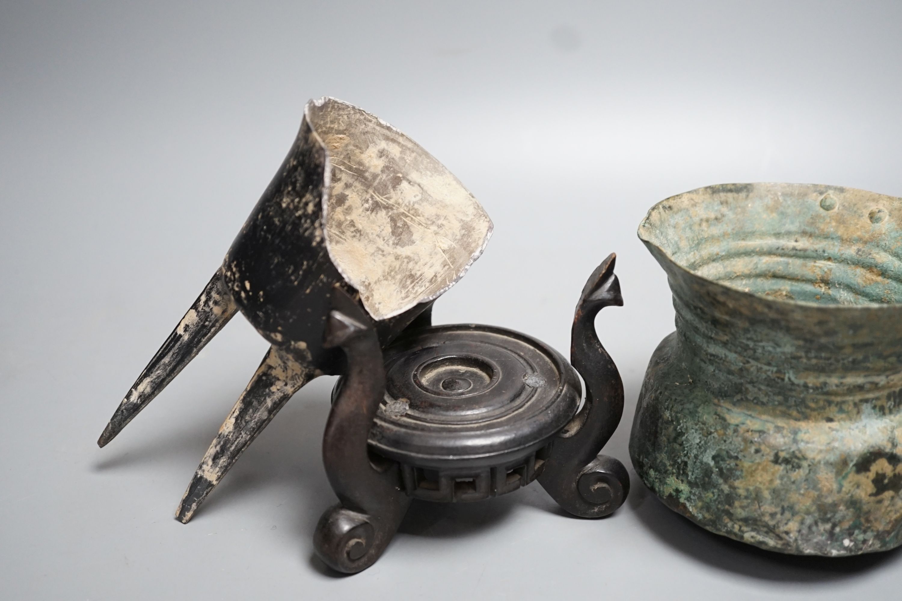 A Han dynasty pottery tripod vessel and a Roman jug